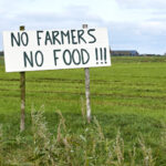 Sign in agricultural field with text No Farmers No Food. Farmers in the Netherlands protesting against forced shrinking of livestock because of CO2 and nitrogen emissions as measured bij the RIVM.